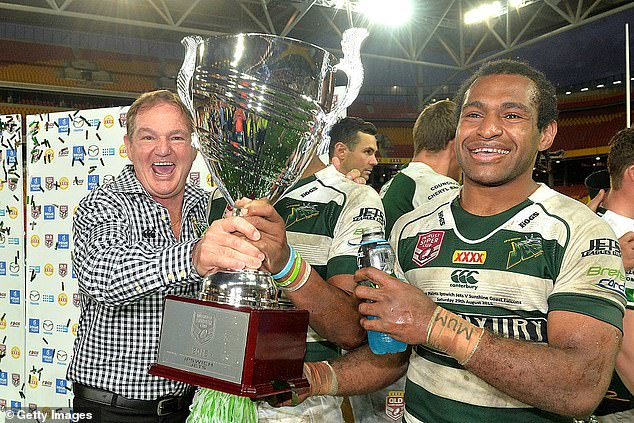 Former Ipswich Mayor Paul Pisasale celebrates victory with Jets' Richard Pandia after the Queensland Cup Rugby League Grand Final in 2015