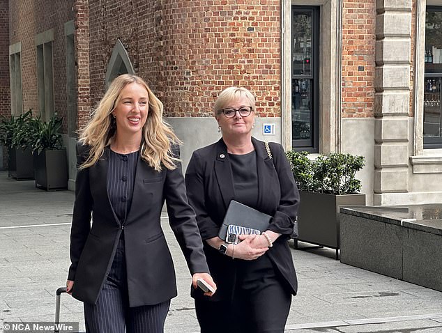 Linda Reynolds is photographed with one of her attorneys outside the Supreme Court in Washington in August.