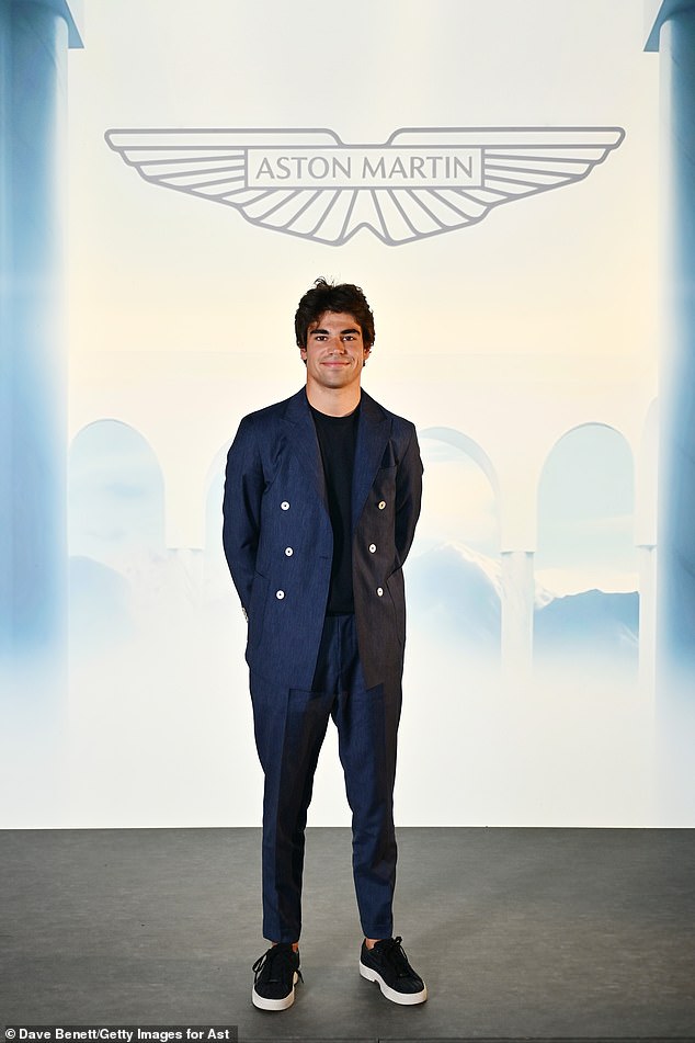 Formula One driver Lance Stroll was also in attendance, looking dapper in a navy double-breasted suit which he paired with a black T-shirt and black and white shoes.