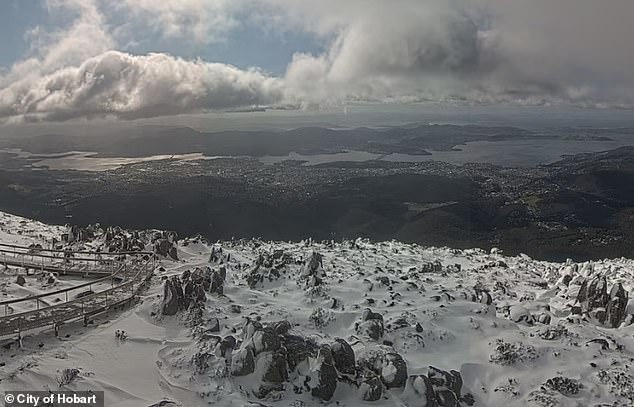 Temperatures dropped to a low of -3 degrees at Kunanyi/Mt Wellington (pictured) on Monday night, with wind chill and heavy snowfall resulting in a wind chill of -21.6°C.