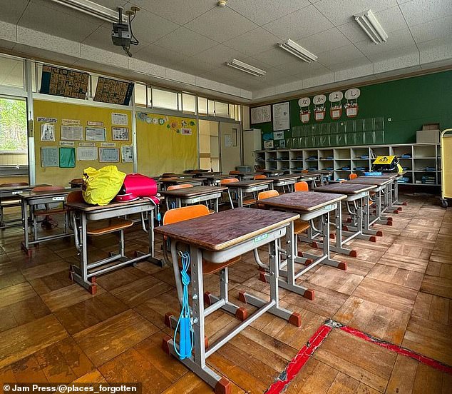 The school still had homework hanging on the walls and bags placed on the desks.