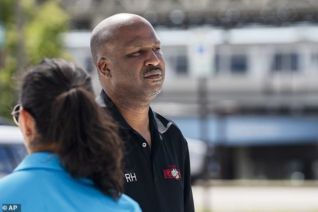 Forest Park Mayor Rory Hoskins stands outside the closed Forest Park Blue Line train station in Forest Park, Illinois, after holding a press conference regarding four people who were fatally shot on the train early Monday morning, September 2, 2024.