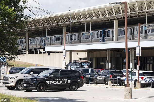 Elmwood Park Police, Berwyn Police, and Cicero Police patrol cars are parked in the parking lot of the Forest Park Blue Line train station in Forest Park, Illinois, after four people were fatally shot on the train early Monday morning, September 2, 2024.