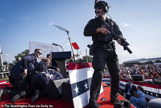 Secret Service agents protected Trump on the ground in the seconds after he was hit by a gunman's bullet at a rally in Butler, Pennsylvania, last month.