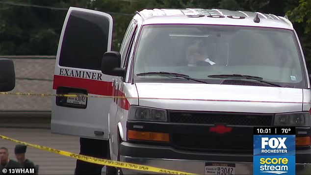 The victims were identified as Fraime Ubaldo, 30, Marangely Moreno-Santiago, 26, Evangeline Ubaldo-Moreno and Sebastian Ubaldo-Moreno. (Pictured: Medical examiner at the scene)