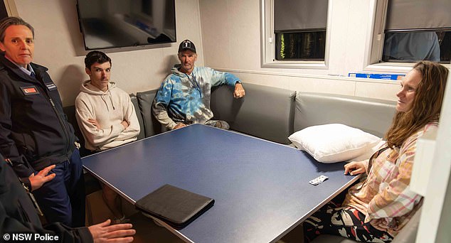 The sailors said they didn't get much sleep the night before their rescue, but once on the Nemesis they felt safe and were able to sleep (pictured: Brett in the middle, dressed in blue; Lisa, right).