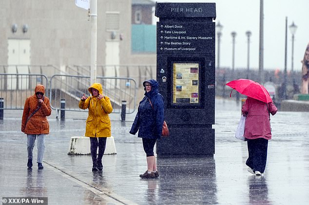 Data from earlier this year shows that the UK received particularly large amounts of rain in winter and spring, with some areas seeing up to three times more rainfall than average. Pictured: Heavy rain in Liverpool on 22 May