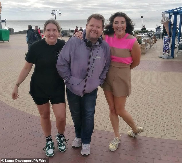 The actor and writer appeared to be in high spirits as he posed for photos in the Welsh city.