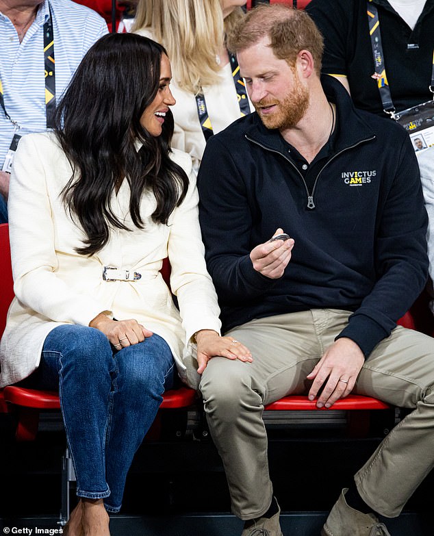 Harry and Meghan attend the volleyball match on the second day of the Invictus Games in April 2022