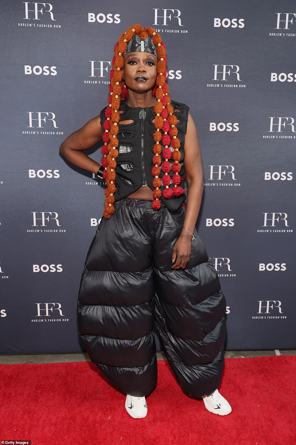 Essence CEO Caroline A. Wanga showed off her unique sense of style in a black zip-up slit vest and black quilted pants.