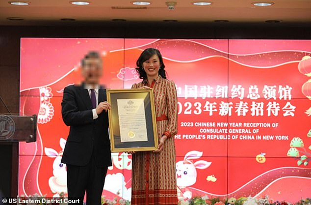 Sun is shown above being honored at a People's Republic of China consulate event in an image included in the Justice Department's indictment.