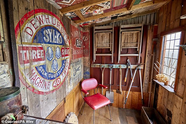 It took two weeks to build the shed and another six weeks to paint the murals, which are Wayne's favorite part of the structure.