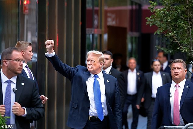 Former US President Donald Trump (center) gestures to the media and crowd outside Trump Tower after a jury found him guilty on all 34 charges in his criminal trial in New York.