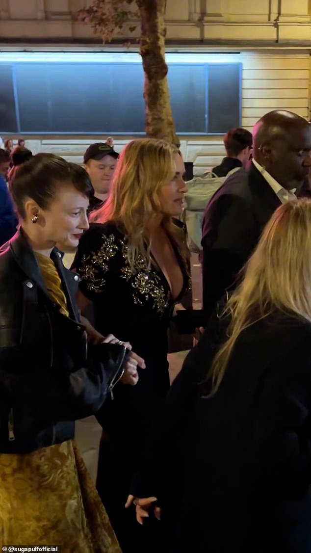 In the video, Kate emerges from her vehicle, surrounded by security and her team on either side of her as they begin to walk down the red carpet.