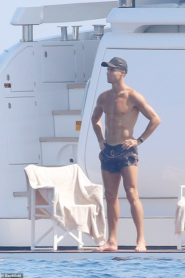 Ronaldo, meanwhile, showed off his toned abs as he went shirtless in a pair of striped shorts.