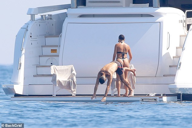 Ronaldo showed off his impressive diving skills as he headed into the water for a swim.