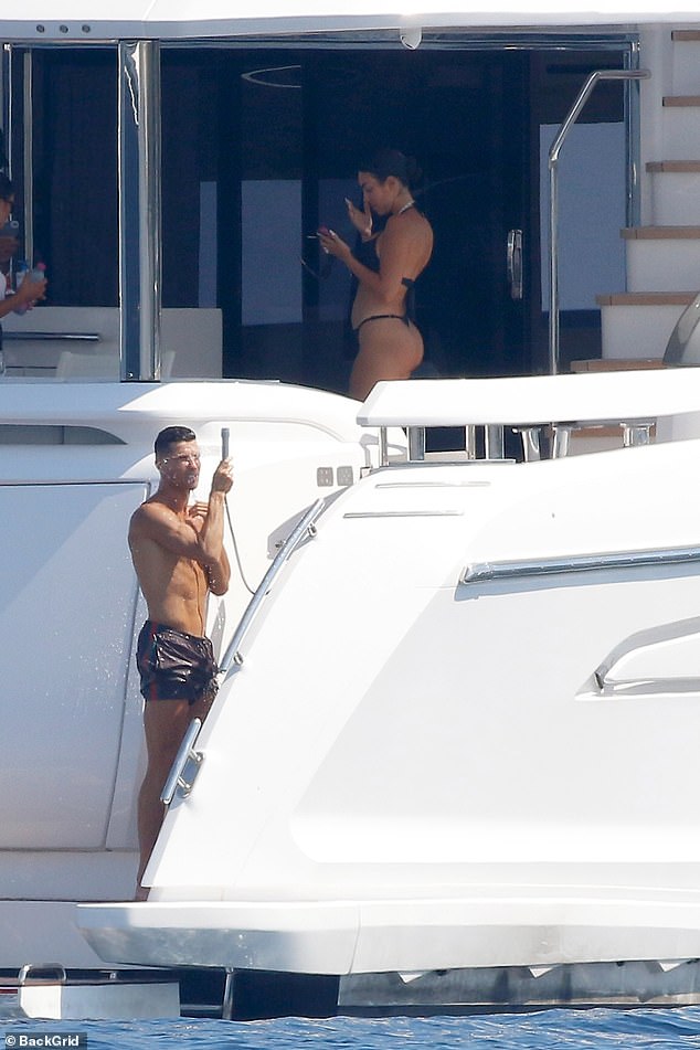 Georgina checked her phone while Ronaldo was taking a shower after swimming.