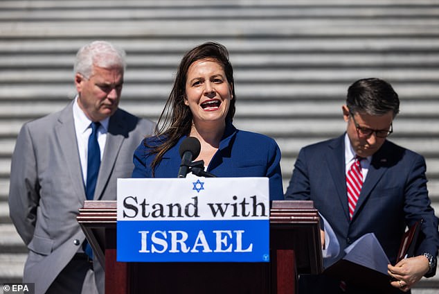 House Republican Conference Chair Elise Stefanik (center), along with House Majority Leader Tom Emmer (left) and House Speaker Mike Johnson (right), speak at a news conference.