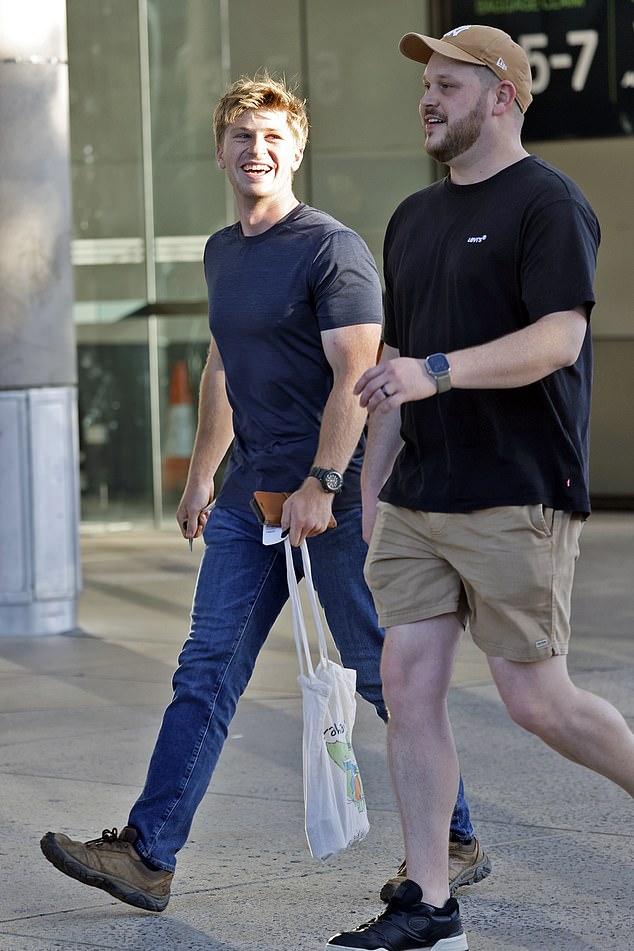 Accompanying the couple was Bindi's younger brother Robert, 20, who flashed his signature smile as he strolled through the airport.