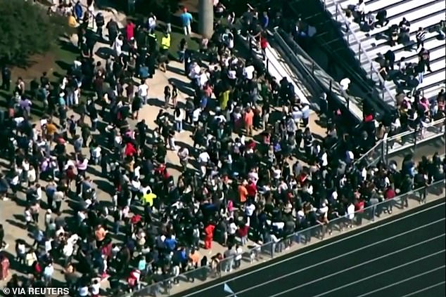 The students were ordered to gather on the football field before being released from their parents' custody.