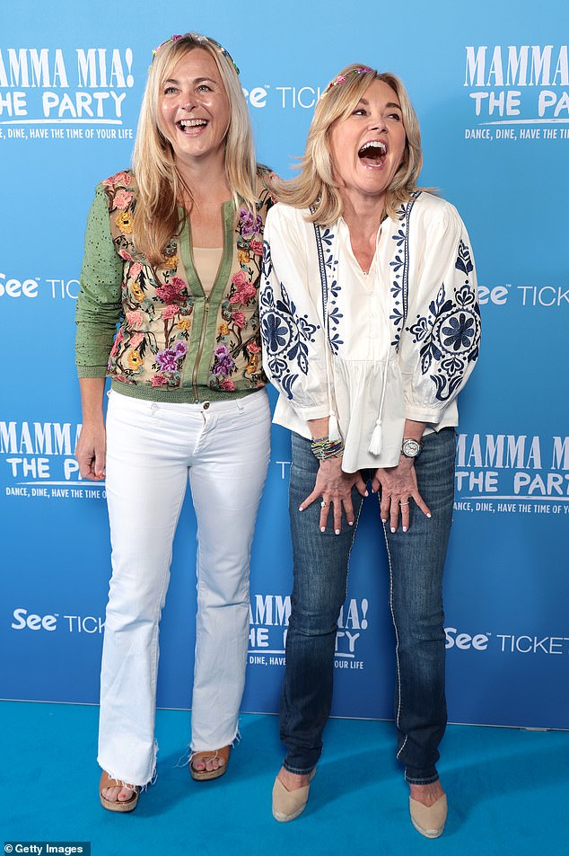 She appeared in high spirits as she posed for a photo with fellow presenter Philippa Forrester, 55, who sported a rustic beach look in white flared trousers and a green floral jacket.