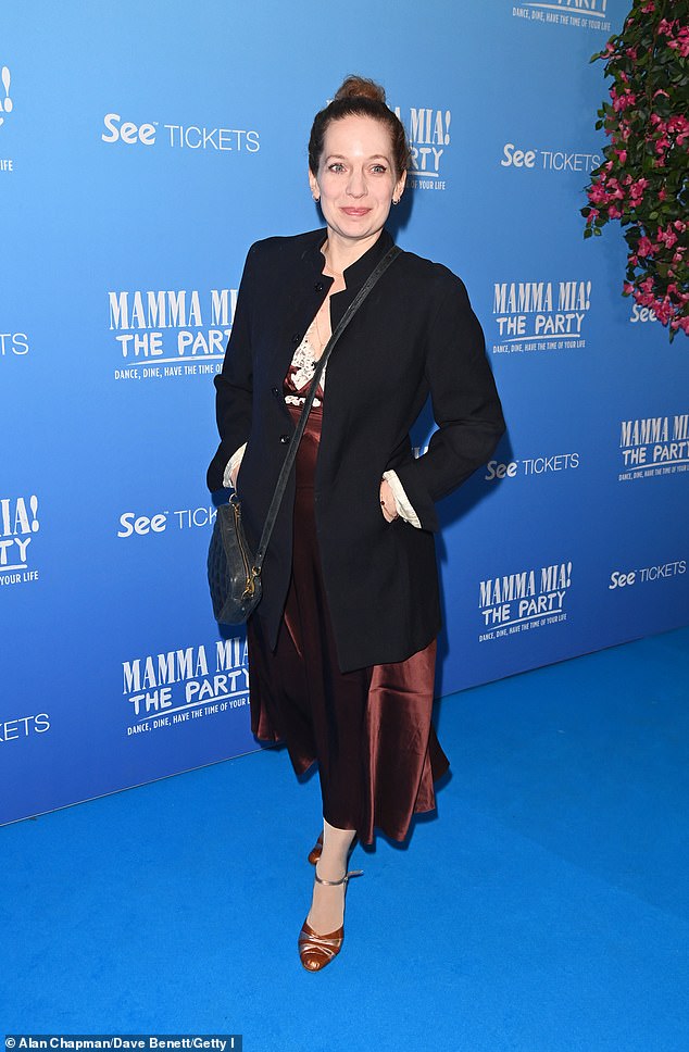 Katherine Parkinson, 46, from The IT Crowd, rocked a sophisticated slip dress and coat.