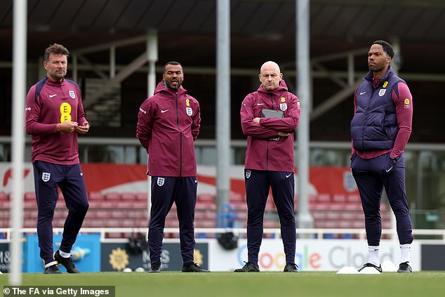 Carsley was assisted by Chris Jones (left), Joleon Lescott (right) and Ashley Cole (second from left)