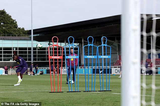 Crystal Palace star Eberechi Eze pictured (left) taking a free-kick during Wednesday's session