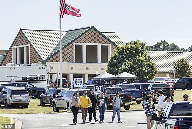 A mother described the scenes outside the high school as 'chaos'