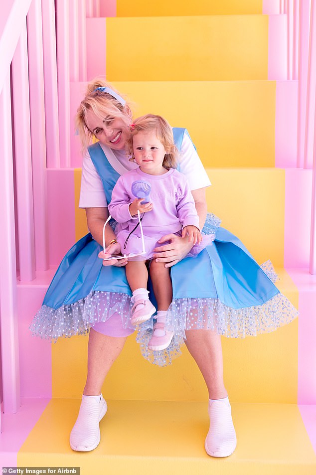 Rebel Wilson and her one-year-old daughter, Royce, pose for more photos at Polly Pocket's house