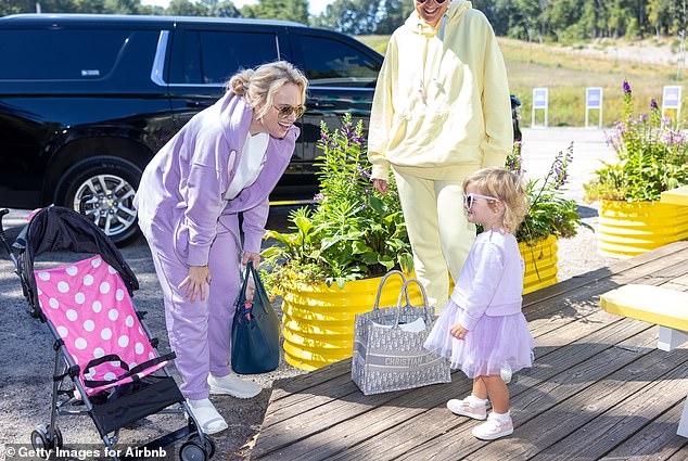 Rebel's daughter Royce wore a matching pastel purple tracksuit paired with a purple tutu and the same heart-shaped sunglasses as her mom for the outing.