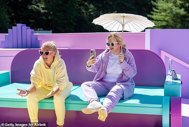 Ramona Agruma and Rebel Wilson arrived for the photo shoot in matching understated tracksuits in shades of purple and yellow, accessorized with pink and white heart-shaped sunglasses.