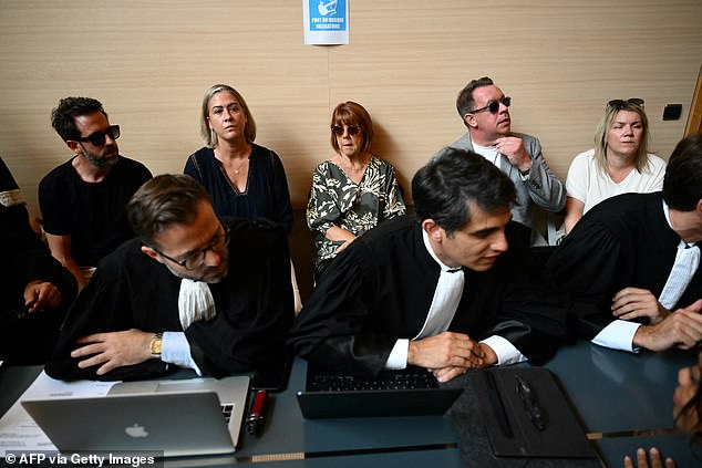 Gisele Pelicot (center) sits with her daughter Caroline Darian (second from left) and sons Florian Pelicot (left) and David Pelicot (second from right) with her wife Celine F. (right), in court during her husband's trial on September 2.