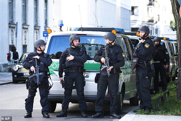 Police officers patrol after police shot a suspicious person near the Israeli consulate and a museum about the city's Nazi-era history in Munich, Germany, Thursday, Sept. 5, 2024.