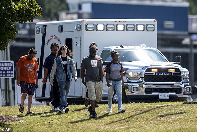 Students and parents leave Apalachee High School campus