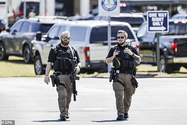 Police officers at the scene of a shooting at Apalachee High School in Winder, Georgia