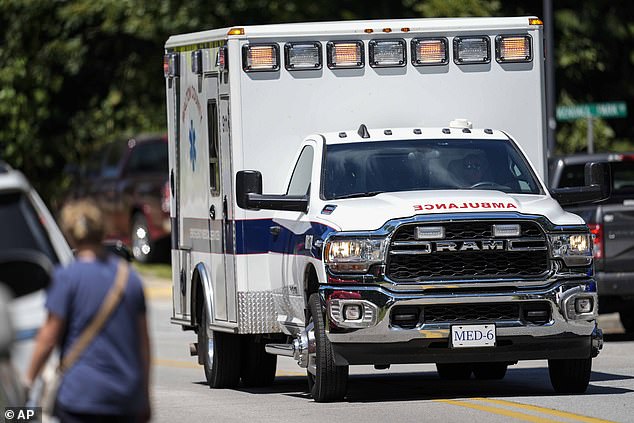 An ambulance leaves Apalachee High School after a shooting at the school.