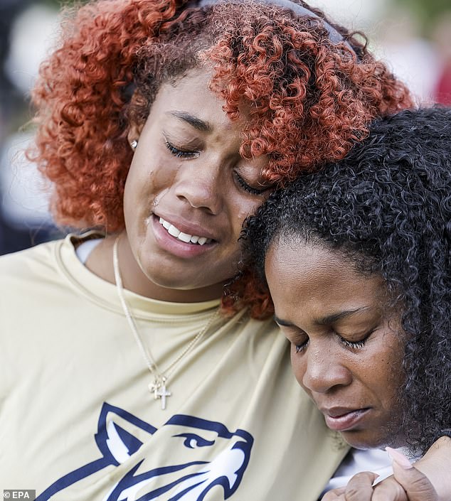 People gather during a vigil for the victims of a school shooting that took place today at Apalachee High School in Winder, Georgia, U.S., September 4, 2024. According to the Georgia Bureau of Investigation, four people were killed, nine people were injured and the suspect is in custody.