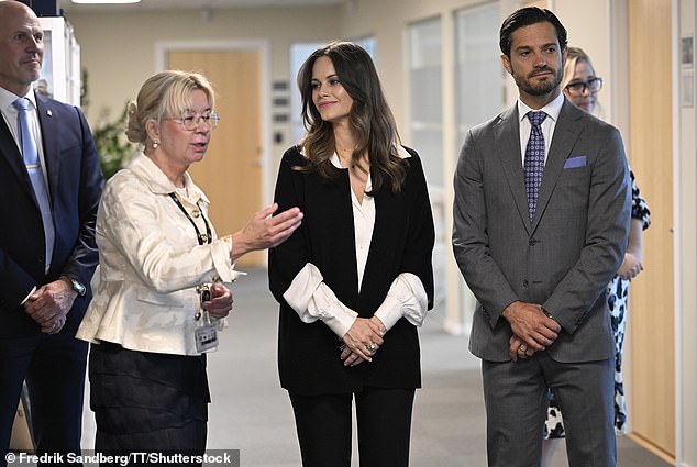 Prince Carl Phillip looked the epitome of good taste in a smart grey suit and pale blue handkerchief, his beard neatly trimmed and his hair slicked back.