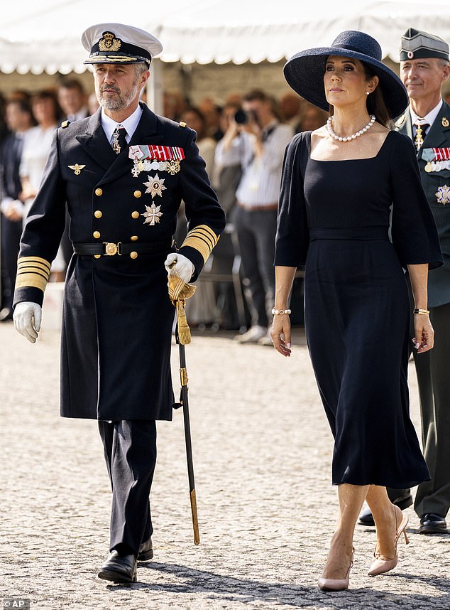 King Frederik, 56, dressed in military garb, also appeared emotional as he laid a wreath. Veterans also attended the service.