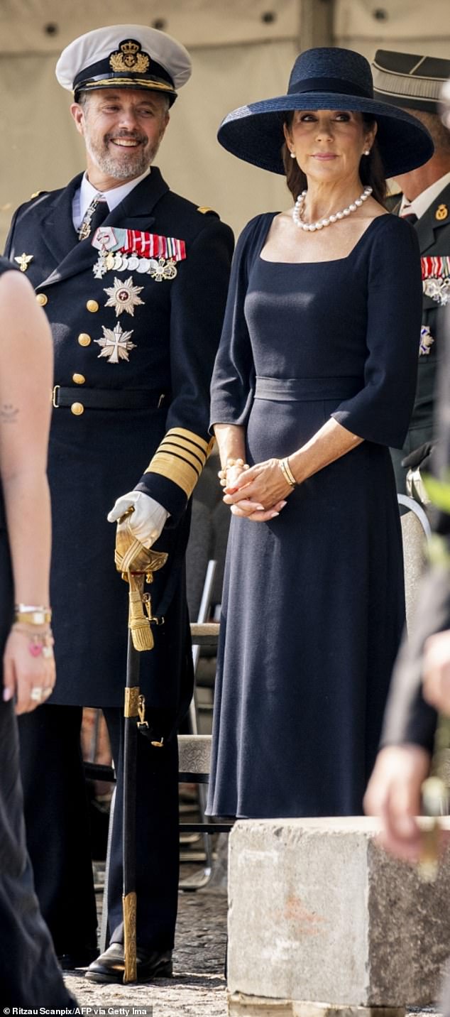 Mary paired her ensemble with a sophisticated large pearl necklace and matching earrings, as well as a bracelet.