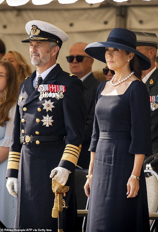 Queen Mary of Denmark looked excited as she joined her husband King Frederik for Flag Day in Copenhagen today.