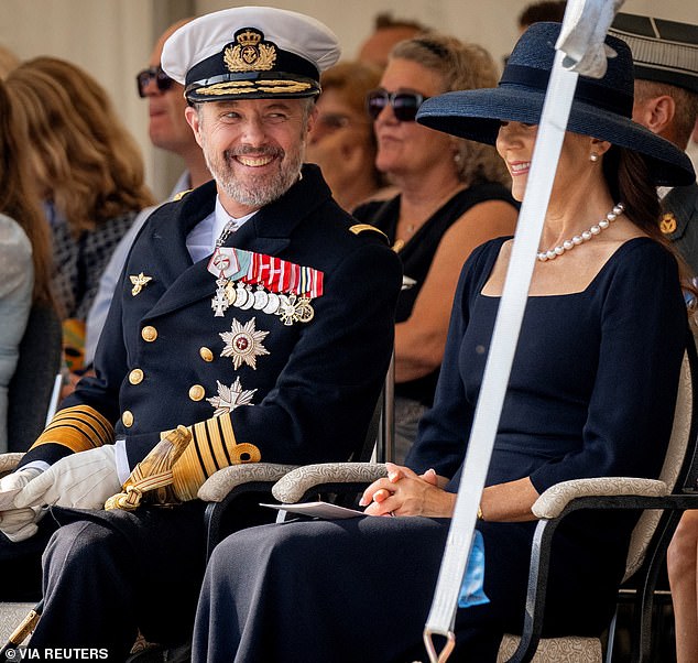 The monarch managed to crack a smile with his wife as he sat beside her during the ceremonies.