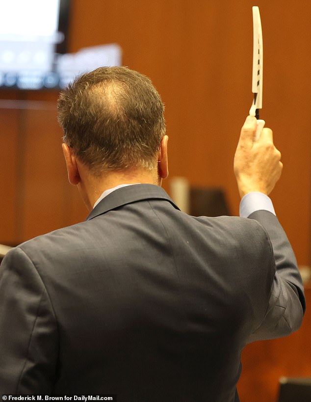 The murder trial, presided over by Judge Mildred Escobedo, featured dramatic scenes when the Los Angeles deputy district attorney held up the alleged murder weapon, a knife, and its holster for the jury to examine.