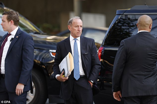 Hunter's attorney, Abbe Lowell, arrives at the First Street federal courthouse in Los Angeles on Thursday and informs the judge of the surprise reversal of the guilty plea as jury selection was set to begin.