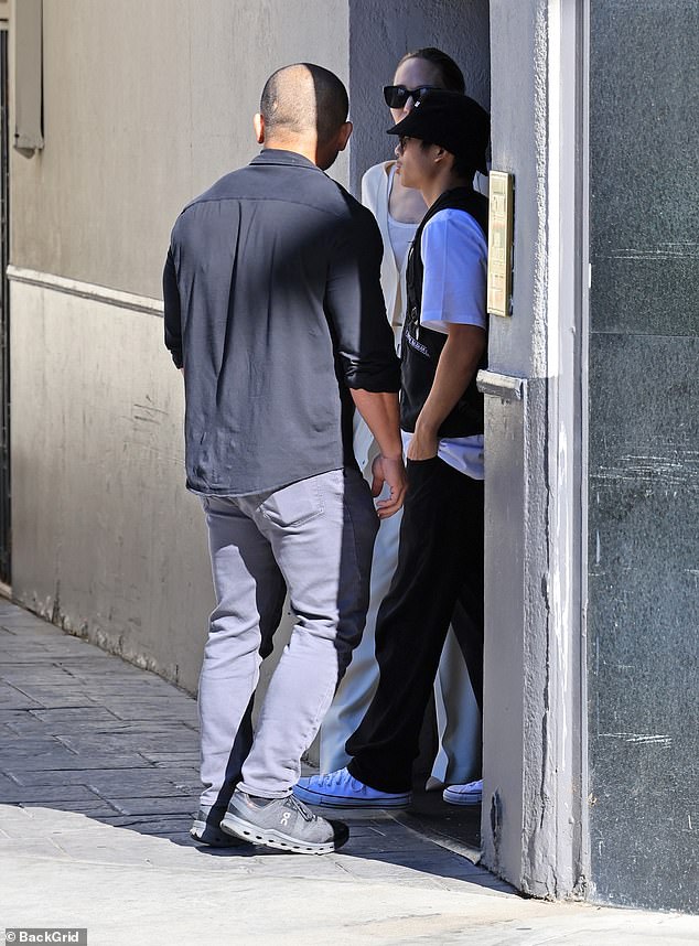 Pax was seen chatting with his mother as they left their lunch break.