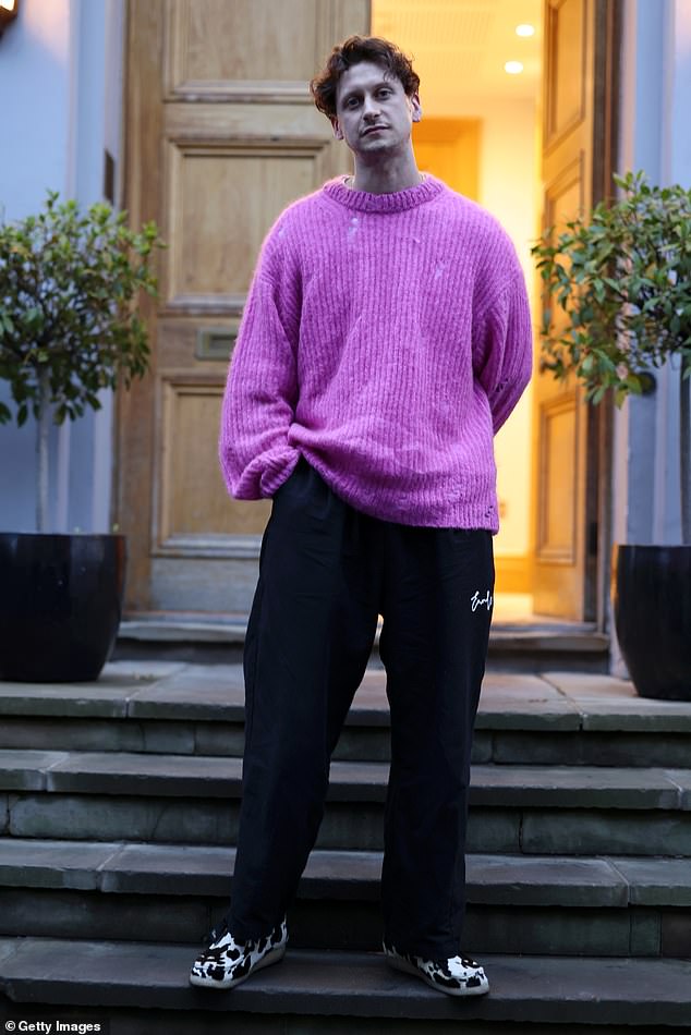 Barry Can't Swim turned heads in a striking purple knit jumper, black wide-leg trousers and cow-print shoes.