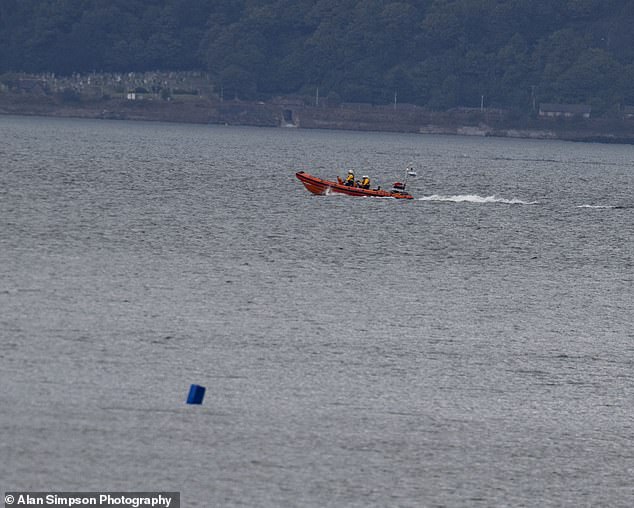 The search continued with police presence in Granton Harbour (pictured: a boat searching for the missing woman)