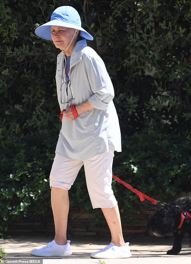 Field was spotted in Los Angeles walking her small black dog on a red leash.