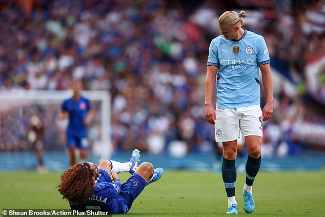 Cucurella was desperate for Haaland to help him with a cramp, but he wouldn't have any part of it.